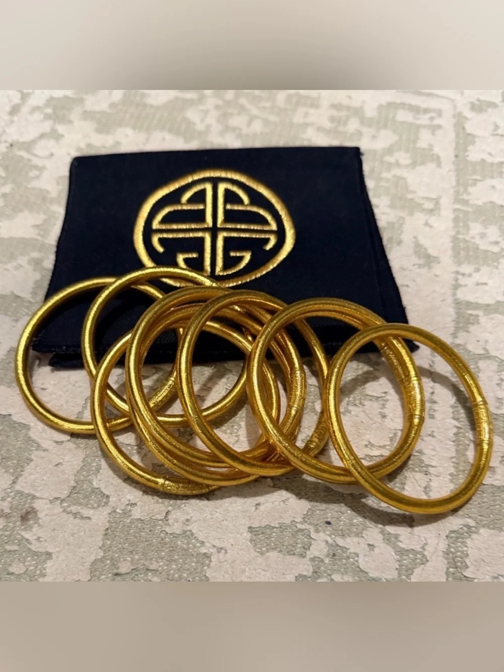 Gold-Tone Stacking Bangles Set with Decorative Pouch